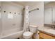 Clean and well-maintained bathroom with a shower-tub combo, white tile, and a modern vanity at 4661 14Th St, Boulder, CO 80304