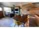 Open-concept dining area featuring unique wood accent wall, modern lighting, and seamless flow to the living area at 4661 14Th St, Boulder, CO 80304