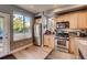 Bright kitchen features stainless appliances, plenty of cabinet space and a window with natural light at 4661 14Th St, Boulder, CO 80304