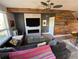 Comfortable living area featuring a fireplace, modern decor, and unique wood accent wall that adds warmth at 4661 14Th St, Boulder, CO 80304