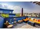 Rooftop deck with outdoor seating, potted plants, and city views, perfect for relaxation and entertainment at 4661 14Th St, Boulder, CO 80304