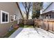 This backyard includes a deck, a wooden fence, and privacy landscaping, ideal for outdoor enjoyment at 15427 E Oberlin Pl, Aurora, CO 80013