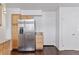 Kitchen showcasing stainless steel refrigerator and ample cabinet space at 15427 E Oberlin Pl, Aurora, CO 80013