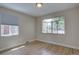Cozy bedroom with hardwood floors and bright windows provide natural light at 2812 Krameria St, Denver, CO 80207