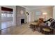 Inviting living room with hardwood floors, brick fireplace, and neutral paint colors at 2812 Krameria St, Denver, CO 80207