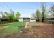 Large backyard with a mix of grass and mulch at 7841 Oneida St, Commerce City, CO 80022