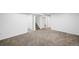 Spacious basement area with carpet flooring and stairs leading to the upper level at 7841 Oneida St, Commerce City, CO 80022