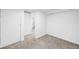 Basement room with neutral carpet, two doors, and white walls ready for your personalization at 7841 Oneida St, Commerce City, CO 80022