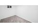 Cozy carpeted bedroom with a window at 7841 Oneida St, Commerce City, CO 80022