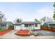 Charming single-story home with a well-manicured lawn and an attached one-car garage at 7841 Oneida St, Commerce City, CO 80022