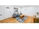Bright living room featuring hardwood floors, modern furniture, and a cozy rug at 7841 Oneida St, Commerce City, CO 80022