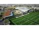 Aerial view of sports complex with training facility, football fields, modern architecture, and green spaces at 16839 E Amherst E Ave, Aurora, CO 80013