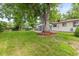Backyard featuring a large shade tree and covered patio at 16839 E Amherst E Ave, Aurora, CO 80013