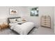 Serene bedroom with a plush bed, natural light, and neutral decor at 16839 E Amherst E Ave, Aurora, CO 80013