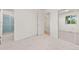 Spacious bedroom with a full bathroom and a large closet with mirrored doors at 16839 E Amherst E Ave, Aurora, CO 80013