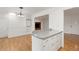 Bright kitchen featuring white cabinets, granite countertops, and hardwood floors at 16839 E Amherst E Ave, Aurora, CO 80013