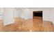 Bright and airy living room with hardwood floors and a custom built-in entertainment center at 16839 E Amherst E Ave, Aurora, CO 80013
