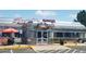 Exterior of retro diner with shiny metal facade, vintage signage, and outdoor seating at 16839 E Amherst E Ave, Aurora, CO 80013