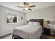 This bedroom features a window, neutral paint, and great lighting at 11008 Hayloft St, Parker, CO 80134