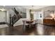 Inviting dining room with hardwood floors, contemporary light fixture and nearby staircase at 11008 Hayloft St, Parker, CO 80134