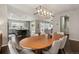 Open dining space with modern lighting fixture and view of the kitchen at 11008 Hayloft St, Parker, CO 80134