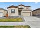 Charming two-story home with a well-maintained front yard and a neutral color palette at 11008 Hayloft St, Parker, CO 80134