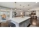 Open-concept kitchen with a large island, seamlessly connecting to the living areas at 11008 Hayloft St, Parker, CO 80134