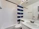 A bathroom with a shower-tub combo and a sink with vanity at 14222 E Hawaii Cir # F, Aurora, CO 80012