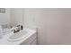 Bathroom featuring a white sink and vanity, with neutral wall color and a mirror at 14222 E Hawaii Cir # F, Aurora, CO 80012