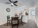 Cozy dining area with a round table and a view of the modern kitchen at 14222 E Hawaii Cir # F, Aurora, CO 80012
