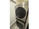 Modern stacked washer and dryer with smart technology at 14222 E Hawaii Cir # F, Aurora, CO 80012