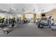 Light, airy gym featuring mirrors and equipment like ellipticals, treadmills and weights at 7440 S Blackhawk St # 4-105, Englewood, CO 80112