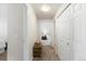 Hallway features storage closet and view into main bedroom at 7440 S Blackhawk St # 4-105, Englewood, CO 80112