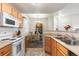 Bright kitchen with stainless steel appliances and opening to the dining area at 7440 S Blackhawk St # 4-105, Englewood, CO 80112