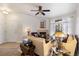 Inviting living room featuring a fireplace, neutral walls, and lots of natural light at 7440 S Blackhawk St # 4-105, Englewood, CO 80112