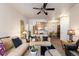 Open-concept living room featuring neutral walls and access to the dining room and kitchen at 7440 S Blackhawk St # 4-105, Englewood, CO 80112