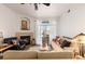 Cozy living room with fireplace, modern ceiling fan, and lots of natural light at 7440 S Blackhawk St # 4-105, Englewood, CO 80112