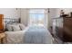 Bedroom with neutral colors, bright windows, and closet at 7440 S Blackhawk St # 4-105, Englewood, CO 80112