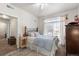 Main bedroom with large window, neutral carpeting, and closet at 7440 S Blackhawk St # 4-105, Englewood, CO 80112