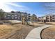 Outdoor playground area offering play equipment, open space and benches at 7440 S Blackhawk St # 4-105, Englewood, CO 80112