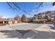 Outdoor pool area showing a winter cover, community pool, and neighborhood buildings at 7440 S Blackhawk St # 4-105, Englewood, CO 80112