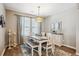 Bright dining room with a farmhouse-style table and bench seating at 10009 Hough Pt, Parker, CO 80134