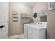 Laundry room with washer, dryer, and shelving at 10009 Hough Pt, Parker, CO 80134