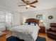Comfortable bedroom with hardwood floors, ceiling fan, and natural light at 1100 Hudson St, Denver, CO 80220