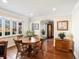 Elegant dining room featuring hardwood floors, large windows, and classic furnishings at 1100 Hudson St, Denver, CO 80220