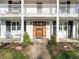 Close-up of the home's inviting front entrance with beautiful wood door at 1100 Hudson St, Denver, CO 80220