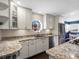 Modern kitchen featuring granite countertops, stainless steel appliances, and ample cabinet space at 1100 Hudson St, Denver, CO 80220