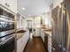 Spacious kitchen featuring modern appliances, granite countertops, and ample cabinet storage at 1100 Hudson St, Denver, CO 80220