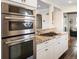 Well-appointed kitchen featuring modern appliances, granite countertops, and ample cabinet storage at 1100 Hudson St, Denver, CO 80220
