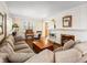 Spacious living room with a cozy fireplace, built-in shelves, and lots of natural light at 1100 Hudson St, Denver, CO 80220